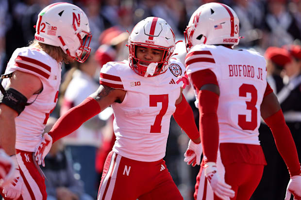 Nebraska Cornhuskers defensive back Malcolm Hartzog Jr. (7) celebrates an interception with defensive back Marques Buford Jr.