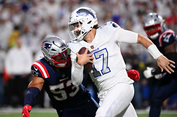 Oct 5, 2025; Orchard Park, New York, USA; Buffalo Bills quarterback Josh Allen (17) rushes the ball past New England Patriots