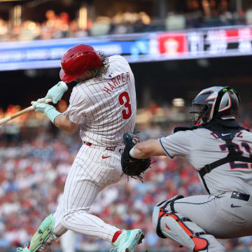 Aug 27, 2024; Philadelphia, Pennsylvania, USA; Philadelphia Phillies first base Bryce Harper (3) hits a single during the first inning against the Houston Astros at Citizens Bank Park. 