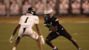 St. Peter Prep's Jevon Ledgister (12) is guarded by Paramus Catholic's Austin Barrett (1) during a high school football game between St. Peter’s Prep and Paramus Catholic in Jersey City on Friday, Aug. 29, 2025.