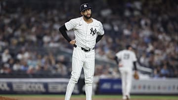 Jul 30, 2025; Bronx, New York, USA;  New York Yankees relief pitcher Devin Williams (38) reacts after giving up a two run home run in the ninth inning against the Tampa Bay Rays at Yankee Stadium. Mandatory Credit: Wendell Cruz-Imagn Images