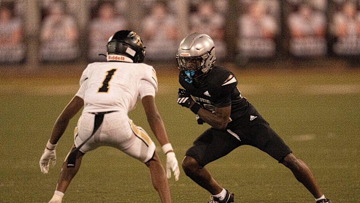 St. Peter Prep's Jevon Ledgister (12) is guarded by Paramus Catholic's Austin Barrett (1) during a high school football game between St. Peter’s Prep and Paramus Catholic in Jersey City on Friday, Aug. 29, 2025. St. Peter Prep's Jevon Ledgister (12) is guarded by Paramus Catholic's Austin Barrett (1) during a high school football game between St. Peter’s Prep and Paramus Catholic in Jersey City on Friday, Aug. 29, 2025.