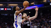 Mar 25, 2024; Sacramento, California, USA; Philadelphia 76ers guard Tyrese Maxey (0) drives to the basket against Sacramento Kings forward Domantas Sabonis (10) during the first quarter at Golden 1 Center. Mandatory Credit: Sergio Estrada-Imagn Images
