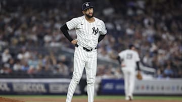 Jul 30, 2025; Bronx, New York, USA;  New York Yankees relief pitcher Devin Williams (38) reacts after giving up a two run home run in the ninth inning against the Tampa Bay Rays at Yankee Stadium. Mandatory Credit: Wendell Cruz-Imagn Images