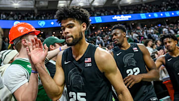 Michigan State's Malik Hall shakes hands with fans after the Spartans win over Illinois on Saturday,