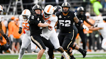 Nov 30, 2024; Nashville, Tennessee, USA;  Tennessee Volunteers defensive lineman Dominic Bailey (90) hits Vanderbilt Commodores quarterback Diego Pavia (2) as he passes the ball during the second half at FirstBank Stadium. Mandatory Credit: Steve Roberts-Imagn Images