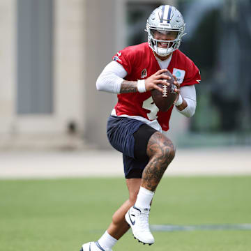 Jun 4, 2024; Frisco, TX, USA;  Dallas Cowboys quarterback Dak Prescott (4) goes through a drill during practice at the Ford Center at the Star Training Facility in Frisco, Texas.