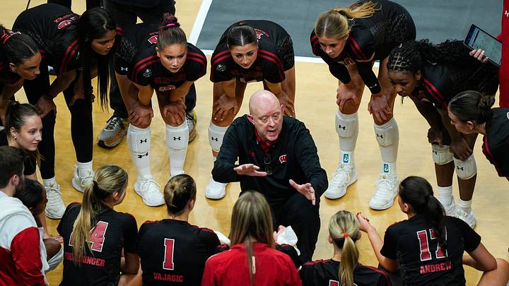 Wisconsin Badgers head coach Kelly Sheffield talks to his players during a timeout Wisconsin Badgers head coach Kelly Sheffield talks to his players during a timeout