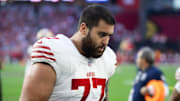 Jan 5, 2025; Glendale, Arizona, USA; San Francisco 49ers guard Dominick Puni (77) against the Arizona Cardinals at State Farm Stadium. Mandatory Credit: Mark J. Rebilas-Imagn Images