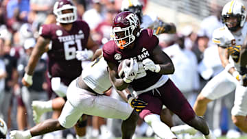 Oct 5, 2024; College Station, Texas, USA; Texas A&M Aggies running back Le'Veon Moss (8) carries the ball in the second half against the Missouri Tigers at Kyle Field. Mandatory Credit: Maria Lysaker-Imagn Images. 