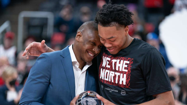 Apr 23, 2022; Toronto, Ontario, CAN; Toronto Raptors president Masai Ujiri presents Toronto Raptors forward Scottie Barnes (4) the 2021-22 Rookie of the Year award before game four of the first round for the 2022 NBA playoffs against the Philadelphia 76ers at Scotiabank Arena. Mandatory Credit: Nick Turchiaro-USA TODAY Sports