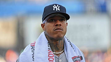 Jun 11, 2024; Kansas City, Missouri, USA; New York Yankees starting pitcher Marcus Stroman (0) looks on before a game against the Kansas City Royals at Kauffman Stadium. Mandatory Credit: Peter Aiken-Imagn Images
