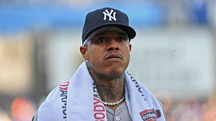 Jun 11, 2024; Kansas City, Missouri, USA; New York Yankees starting pitcher Marcus Stroman (0) looks on before a game against the Kansas City Royals at Kauffman Stadium. Mandatory Credit: Peter Aiken-Imagn Images