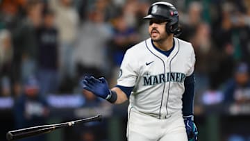 Oct 17, 2025; Seattle, Washington, USA; Seattle Mariners third baseman Eugenio Suarez (28) tosses his bat after hitting a grand slam against the Toronto Blue Jays during the eighth inning during game five of the ALCS round for the 2025 MLB playoffs at T-Mobile Park. Mandatory Credit: Steven Bisig-Imagn Images