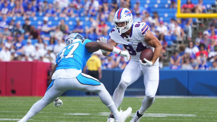 Aug 24, 2024; Orchard Park, NY; Buffalo Bills tight end Zach Davidson (84) runs with the ball after making a catch against Carolina Panthers safety Rudy Ford (37) during the second half at Highmark Stadium. 