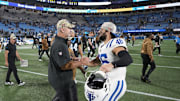 Nov 5, 2023; Charlotte, North Carolina, USA; Carolina Panthers head coach Frank Reich with Indianapolis Colts long snapper Luke Rhodes (46) after the game at Bank of America Stadium. Mandatory Credit: Bob Donnan-Imagn Images