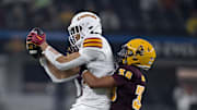 Dec 7, 2024; Arlington, TX, USA; Iowa State Cyclones wide receiver Jayden Higgins (9) catches a pass in front of Arizona State Sun Devils defensive back Kyan McDonald (38) during the second half at AT&T Stadium. Mandatory Credit: Jerome Miron-Imagn Images