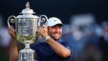 Scottie Scheffler hoists the Wanamaker Trophy after winning the 2025 PGA Championship at Quail Hollow Club