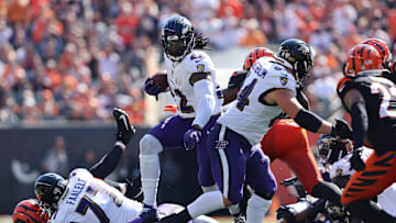 Oct 6, 2024; Cincinnati, Ohio, USA; Baltimore Ravens running back Derrick Henry (22) runs the ball during the first quarter against the Cincinnati Bengals at Paycor Stadium. Mandatory Credit: Joseph Maiorana-Imagn Images