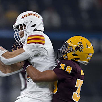Dec 7, 2024; Arlington, TX, USA; Iowa State Cyclones wide receiver Jayden Higgins (9) catches a pass in front of Arizona State Sun Devils defensive back Kyan McDonald (38) during the second half at AT&T Stadium. Mandatory Credit: Jerome Miron-Imagn Images