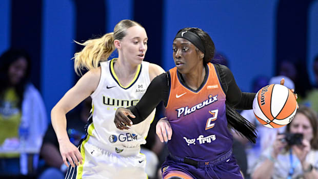 Phoenix Mercury guard Kahleah Copper looks to move the ball past Dallas Wings guard Paige Bueckers