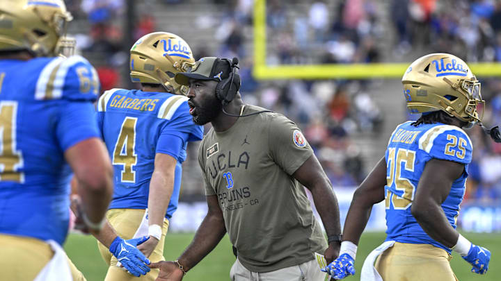 Nov 30, 2024; Pasadena, California, USA; UCLA Bruins head coach DeShaun Foster greets his players after a Bruins touchdown against the Fresno State Bulldogs in the third quarter at Rose Bowl. Mandatory Credit: Robert Hanashiro-Imagn Images Nov 30, 2024; Pasadena, California, USA; UCLA Bruins head coach DeShaun Foster greets his players after a Bruins touchdown against the Fresno State Bulldogs in the third quarter at Rose Bowl. Mandatory Credit: Robert Hanashiro-Imagn Images