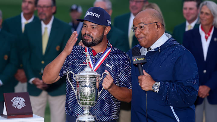 J.J. Spaun celebrates with the U.S. Open trophy as he talks with NBC Sports broadcaster Mike Tirico after winning in June.