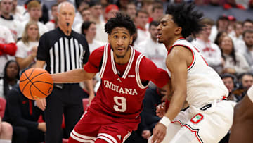 Jan 17, 2025; Columbus, Ohio, USA; Indiana Hoosiers guard Kanaan Carlyle (9) dribbles the ball as Ohio State Buckeyes guard Ques Glover (6) defends during the first half at Value City Arena. Mandatory Credit: Joseph Maiorana-Imagn Images
