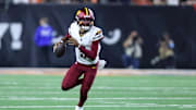 Sep 23, 2024; Cincinnati, Ohio, USA; Washington Commanders quarterback Jayden Daniels (5) runs during the fourth quarter against the Cincinnati Bengals at Paycor Stadium. Mandatory Credit: Joseph Maiorana-Imagn Images