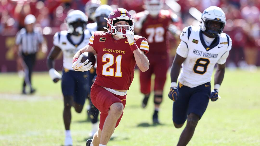 Oct 3, 2026; Ames, Iowa, USA; Iowa State Cyclones running back Aiden Flora (21) breaks through the West Virginia Mountaineers defense for a touchdown during the second half at Jack Trice Stadium. Mandatory Credit: Reese Strickland-Imagn Images Oct 3, 2026; Ames, Iowa, USA; Iowa State Cyclones running back Aiden Flora (21) breaks through the West Virginia Mountaineers defense for a touchdown during the second half at Jack Trice Stadium. Mandatory Credit: Reese Strickland-Imagn Images
