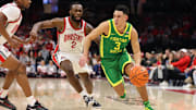 Jan 9, 2025; Columbus, Ohio, USA;  Oregon Ducks guard Jackson Shelstad (3) dribbles the ball past Ohio State Buckeyes guard Bruce Thornton (2) during the first half at Value City Arena. Mandatory Credit: Joseph Maiorana-Imagn Images