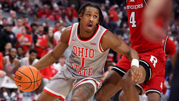 Dec 7, 2024; Columbus, Ohio, USA;  Ohio State Buckeyes guard Meechie Johnson Jr. (1) controls the ball as Rutgers Scarlet Knights guard Ace Bailey (4) defends during the second half at Value City Arena. Mandatory Credit: Joseph Maiorana-Imagn Images
