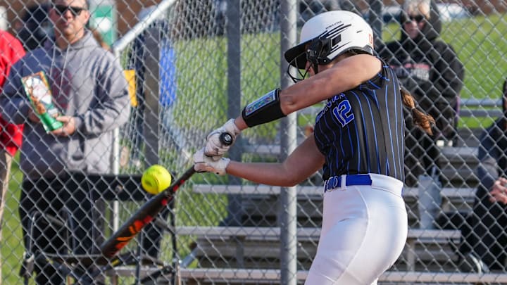 Germantown's Madison Werner (12) makes contact with the ball during a home game versus Divine Savior Holy Angels on Tuesday, April 22, 2025. Germantown's Madison Werner (12) makes contact with the ball during a home game versus Divine Savior Holy Angels on Tuesday, April 22, 2025.