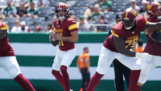 Sam Hartman throws a pass for the Washington Commanders