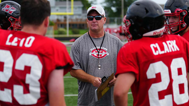 Wisconsin high school football: Muskego head coach Ken Krause works with players during practice on Thursday, August 8, 2024.