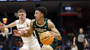 Mar 19, 2024; Dayton, OH, USA; Colorado State Rams guard Nique Clifford (10) dribbles the ball defense by Virginia Cavaliers guard Isaac McKneely (11) in the second half at UD Arena. Mandatory Credit: Rick Osentoski-Imagn Images
