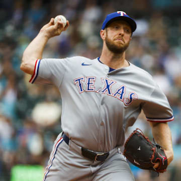 Aug 2, 2025; Seattle, Washington, USA; Texas Rangers starting pitcher Merrill Kelly (23) throws against the Seattle Mariners during the first inning at T-Mobile Park. Mandatory Credit: Joe Nicholson-Imagn Images