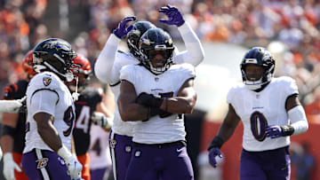Oct 6, 2024; Cincinnati, Ohio, USA; Baltimore Ravens linebacker Tavius Robinson (95) celebrates a sack during the first half against the Cincinnati Bengals at Paycor Stadium. Mandatory Credit: Joseph Maiorana-Imagn Images