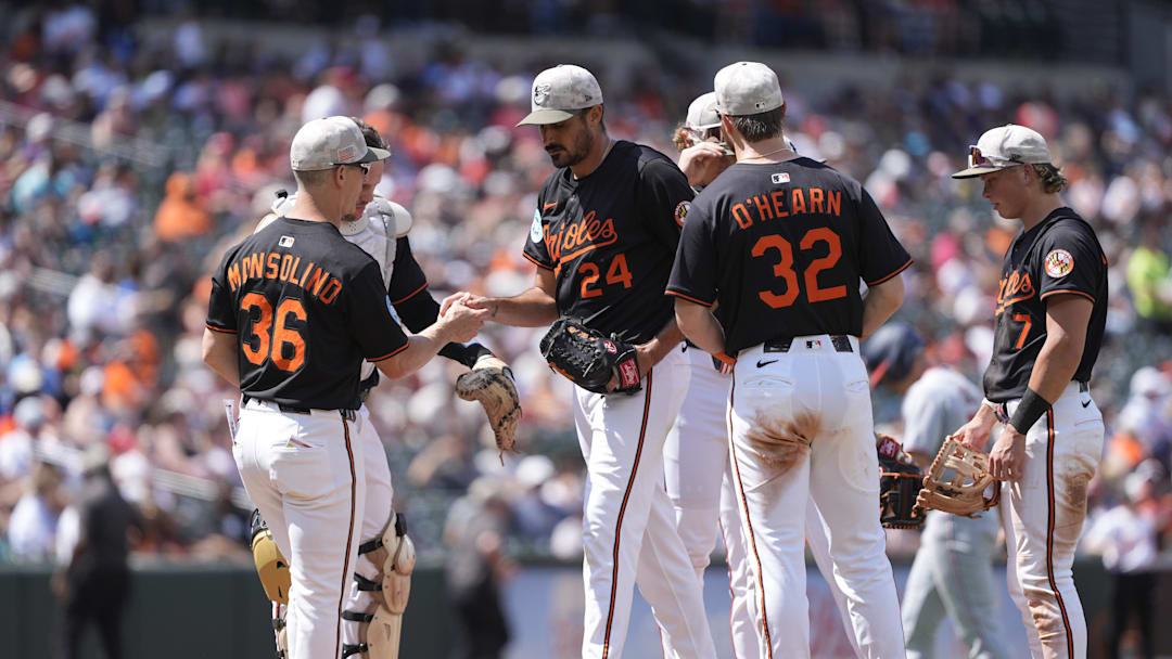 May 18, 2025; Baltimore, Maryland, USA; Baltimore Orioles interim manager Tony Mansolino (36) makes a pitching change taking Baltimore Orioles pitcher Zach Eflin (24) out of the game during the sixth inning against the Washington Nationals at Oriole Park at Camden Yards. 