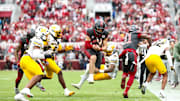 Nov 22, 2025; Norman, Oklahoma, USA;  Oklahoma Sooners quarterback John Mateer (10) runs with the ball as Missouri Tigers safety Santana Banner (15) defends during the second quarter at Gaylord Family-Oklahoma Memorial Stadium. Mandatory Credit: Kevin Jairaj-Imagn Images