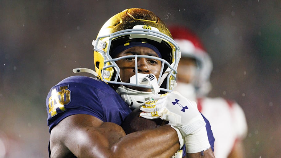Notre Dame RB Jadarian Price returns a kick for a touchdown in the second half of a NCAA football game against USC.