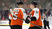 Mar 29, 2025; Philadelphia, Pennsylvania, USA; Philadelphia Flyers center Ryan Poehling (25) reacts with right wing Owen Tippett (74) after scoring a goal against the Buffalo Sabres in the third period at Wells Fargo Center. Mandatory Credit: Kyle Ross-Imagn Images