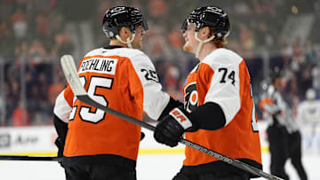 Mar 29, 2025; Philadelphia, Pennsylvania, USA; Philadelphia Flyers center Ryan Poehling (25) reacts with right wing Owen Tippett (74) after scoring a goal against the Buffalo Sabres in the third period at Wells Fargo Center. Mandatory Credit: Kyle Ross-Imagn Images