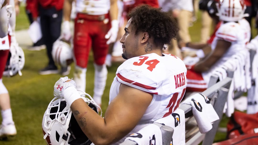 Dec 27, 2022; Phoenix, Arizona, USA; Wisconsin Badgers running back Jackson Acker (34) against the Oklahoma State Cowboys during the 2022 Guaranteed Rate Bowl at Chase Field