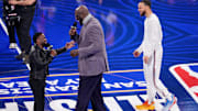 Shaq's OGs general manager Shaquille O'Neal talks with Kevin Hart during the 2025 NBA All-Star Game.