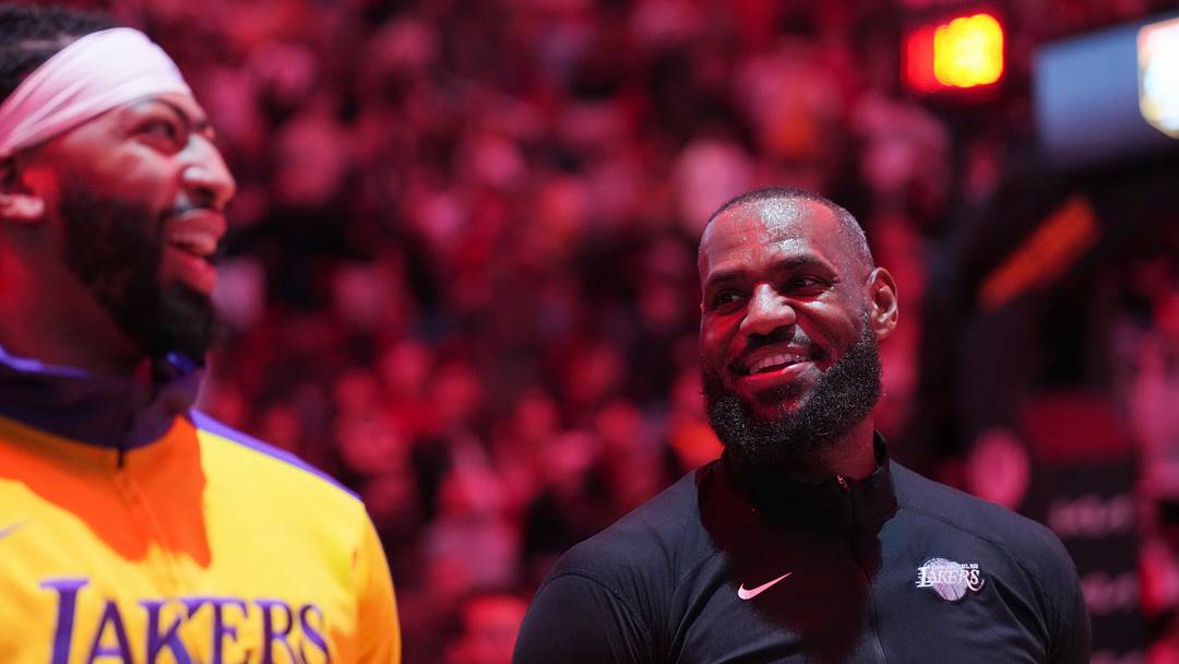Los Angeles Lakers forward LeBron James, right, and forward Anthony Davis during pregame ceremonies before a game against the Miami Heat at Kaseya Center. Mandatory Credit: Jim Rassol-Imagn Images