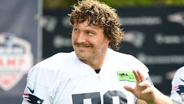 Jul 29, 2022; Foxborough, MA, USA; New England Patriots offensive lineman Cole Strange (50) walks onto the field before training camp at Gillette Stadium. Mandatory Credit: Brian Fluharty-Imagn Images