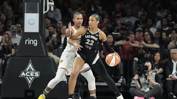 Aug 21, 2025; Las Vegas, Nevada, USA; Las Vegas Aces center A'ja Wilson (22) dribbles against Phoenix Mercury forward Alyssa Thomas (25) in the first quarter of their game at Michelob Ultra Arena. Mandatory Credit: Candice Ward-Imagn Images Aug 21, 2025; Las Vegas, Nevada, USA; Las Vegas Aces center A'ja Wilson (22) dribbles against Phoenix Mercury forward Alyssa Thomas (25) in the first quarter of their game at Michelob Ultra Arena. Mandatory Credit: Candice Ward-Imagn Images