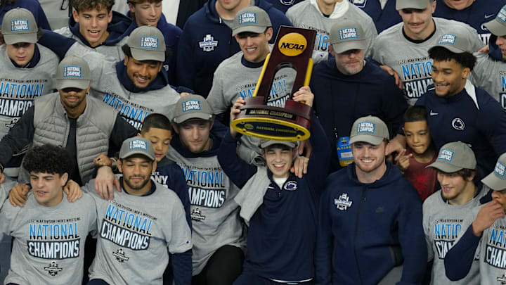 Penn State wrestling team hoisting its 2025 NCAA Division I Men's Wrestling Championship trophy