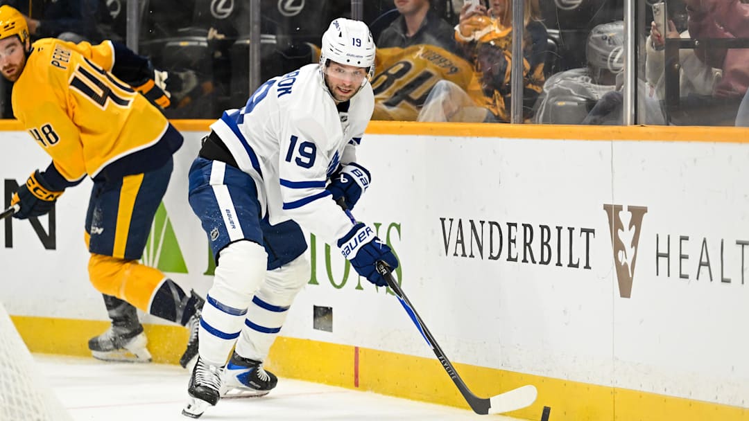 Dec 20, 2025; Nashville, Tennessee, USA;  Toronto Maple Leafs center Calle Jarnkrok (19) skates behind the net against the Nashville Predators during the second period at Bridgestone Arena. Mandatory Credit: Steve Roberts-Imagn Images